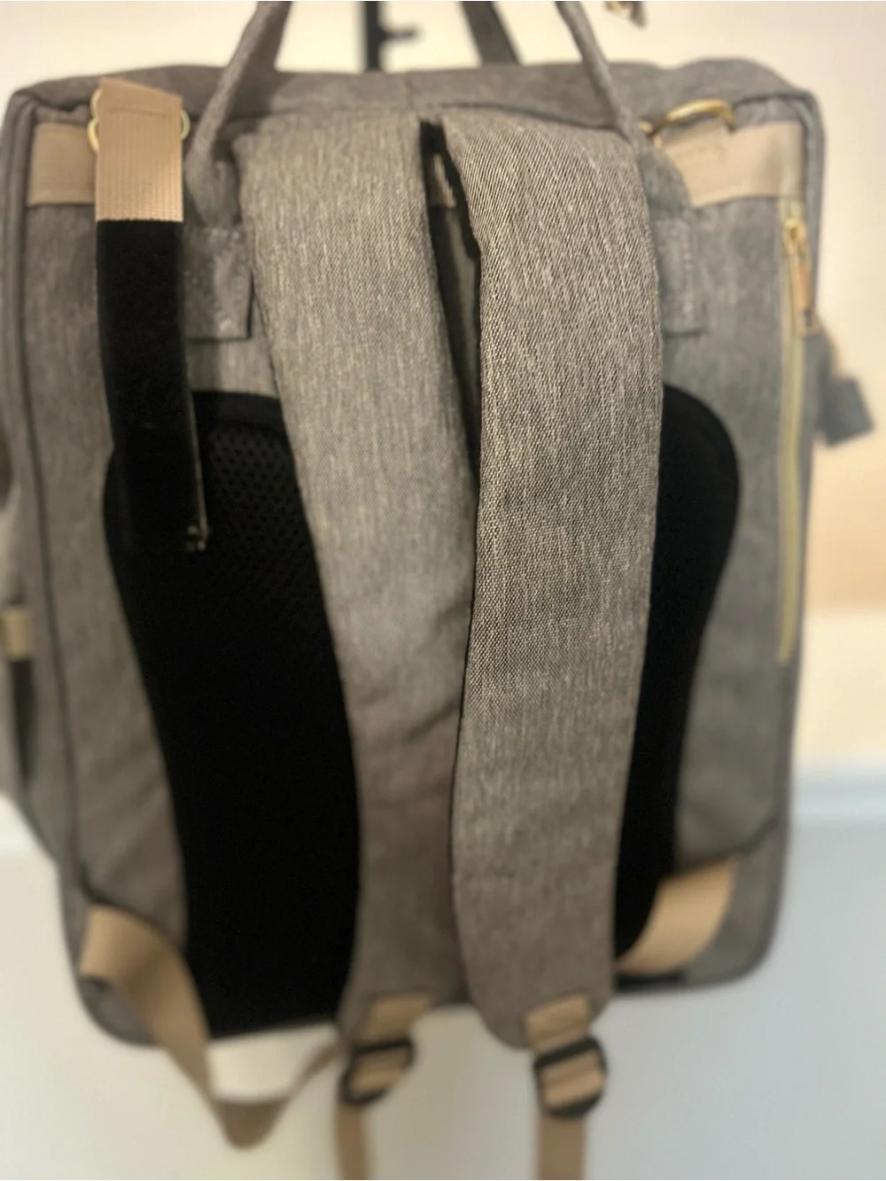 Happy Luoka 3-in-1 diaper bag backpack with built in travel crib & changing pad.